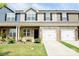 Charming townhome with a well-manicured lawn and attached garages at 525 San Marco Dr, Gastonia, NC 28056