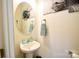 Cozy powder room featuring stylish mirror, sink, and decor, ideal for guests at 525 San Marco Dr, Gastonia, NC 28056