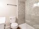 Modern bathroom featuring white toilet, vanity, and a glass door walk in shower at 530 W Franklin St, Salisbury, NC 28144