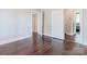 Bedroom with dark hardwood floors and white trim doors leading to other rooms at 530 W Franklin St, Salisbury, NC 28144