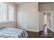 Bedroom with wood paneled walls and hardwood floors and a closet with drawers at 530 W Franklin St, Salisbury, NC 28144
