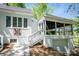 Charming white home with a garage, screened porch, and colorful quilt decoration at 530 W Franklin St, Salisbury, NC 28144