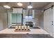 Modern kitchen featuring white cabinets, stainless steel appliances, and a stylish dining area at 530 W Franklin St, Salisbury, NC 28144