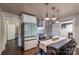 Well-appointed kitchen with stainless steel appliances, a dining table, and hardwood floors at 530 W Franklin St, Salisbury, NC 28144