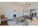 Spacious living room with a decorative fireplace, wood floors, and natural light at 530 W Franklin St, Salisbury, NC 28144