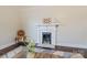 Living room with a decorative fireplace and a chair in front of the fireplace at 530 W Franklin St, Salisbury, NC 28144