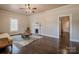 Cozy living room featuring a decorative fireplace and gleaming hardwood floors at 530 W Franklin St, Salisbury, NC 28144