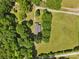 An aerial shot of the house shows the well-kept yard and the tree-lined property at 5317 Friendly Baptist Ch Rd, Indian Trail, NC 28079