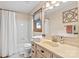 Cozy bathroom features a vanity, commode, shower/tub combination, and natural light at 5317 Friendly Baptist Ch Rd, Indian Trail, NC 28079