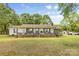 Ranch home with inviting front porch and well-manicured lawn at 5317 Friendly Baptist Ch Rd, Indian Trail, NC 28079