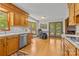 Bright kitchen with bay windows, white countertops, and a modern dishwasher at 5317 Friendly Baptist Ch Rd, Indian Trail, NC 28079
