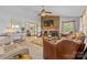 Spacious living room with brick fireplace, ceiling fan, and comfortable seating at 5317 Friendly Baptist Ch Rd, Indian Trail, NC 28079