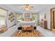 Bright main bedroom featuring two windows, a neutral color scheme, and wooden furniture accents at 5317 Friendly Baptist Ch Rd, Indian Trail, NC 28079