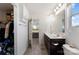 Bathroom with double sinks, a large mirror, and a walk-in closet at 548 Dutch White Dr, Clover, SC 29710