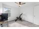 Bright bedroom with a ceiling fan, a window, and an exercise bike, offering a simple and functional space at 548 Dutch White Dr, Clover, SC 29710