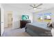 Bedroom with a large window, a ceiling fan, and an en-suite bathroom at 548 Dutch White Dr, Clover, SC 29710