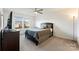 Bedroom with a large window, a ceiling fan, and a dark wood dresser at 548 Dutch White Dr, Clover, SC 29710