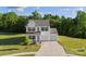 Beautiful exterior view of a well-maintained two-story home with a lush green lawn at 548 Dutch White Dr, Clover, SC 29710