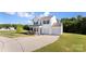 Inviting home featuring a two-car garage, manicured lawn, and classic design elements at 548 Dutch White Dr, Clover, SC 29710