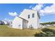View of the house with white siding, a well-maintained lawn, and an AC unit, ideal for comfortable living at 548 Dutch White Dr, Clover, SC 29710