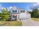Charming two-story home with a welcoming front porch and a spacious two car garage at 548 Dutch White Dr, Clover, SC 29710