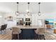 Spacious kitchen with a large island, stainless steel appliances, and modern pendant lighting at 548 Dutch White Dr, Clover, SC 29710