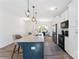 Bright kitchen with granite countertops, stainless steel appliances and pendant lighting over the island at 548 Dutch White Dr, Clover, SC 29710