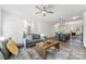 Open living area with modern furnishings, a view of the kitchen, and staircase access at 548 Dutch White Dr, Clover, SC 29710