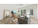 Cozy living room with a gray sofa, a ceiling fan, and a rustic wooden coffee table at 548 Dutch White Dr, Clover, SC 29710
