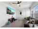 Cozy living room featuring a ceiling fan, gray sofa and a wall-mounted TV for relaxation and entertainment at 548 Dutch White Dr, Clover, SC 29710