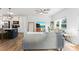 Bright living room featuring a gray sofa, ceiling fan, and an entertainment center at 548 Dutch White Dr, Clover, SC 29710
