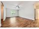 Spacious living room featuring hardwood floors and a ceiling fan at 5604 Bradford Lake Ln, Charlotte, NC 28269