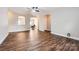 Open concept living room featuring hardwood floors and arched doorways at 5604 Bradford Lake Ln, Charlotte, NC 28269