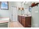 Bathroom features include double sinks, vanity, and bathtub at 5722 Kirkwynd Commons Dr, Charlotte, NC 28278