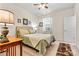 Comfortable bedroom featuring a ceiling fan, window with blinds, and wooden desk at 5722 Kirkwynd Commons Dr, Charlotte, NC 28278