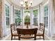 Charming breakfast nook with natural light, bay windows, and chandelier lighting at 5722 Kirkwynd Commons Dr, Charlotte, NC 28278