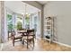 Bright breakfast nook featuring bay window, chandelier and tile flooring at 5722 Kirkwynd Commons Dr, Charlotte, NC 28278