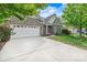 Well-maintained brick house with a two-car garage and beautiful landscaping at 5722 Kirkwynd Commons Dr, Charlotte, NC 28278