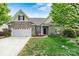 Charming brick home with manicured lawn, two-car garage, and beautiful landscaping at 5722 Kirkwynd Commons Dr, Charlotte, NC 28278