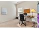 Functional home office featuring a desk, ample lighting, and a large window at 5722 Kirkwynd Commons Dr, Charlotte, NC 28278