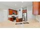 Bright kitchen with wood cabinets, stainless appliances, a kitchen island and neutral countertops at 5722 Kirkwynd Commons Dr, Charlotte, NC 28278