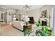 Bright living room with a fireplace and large windows providing natural light at 5722 Kirkwynd Commons Dr, Charlotte, NC 28278