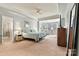 Spacious main bedroom with a tray ceiling, large windows and en suite bathroom at 5722 Kirkwynd Commons Dr, Charlotte, NC 28278