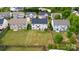 Aerial view of home featuring a large lawn, patio, and privacy fence at 5803 Lindley Crescent Dr, Indian Trail, NC 28079