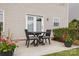 A cozy back patio set with table and chairs, perfect for outdoor dining at 5803 Lindley Crescent Dr, Indian Trail, NC 28079