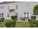Backyard view featuring a patio set, lush lawn, and light siding at 5803 Lindley Crescent Dr, Indian Trail, NC 28079