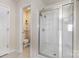 This bathroom features a standing shower visible from the door with commode visible in the hall at 5803 Lindley Crescent Dr, Indian Trail, NC 28079