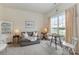 Cozy living room with a comfortable sofa, decorative lamps, and natural light at 5803 Lindley Crescent Dr, Indian Trail, NC 28079