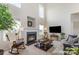 Bright living room with high ceilings, a fireplace, and large windows at 5803 Lindley Crescent Dr, Indian Trail, NC 28079