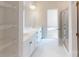 Bright bathroom boasts double sink vanity, open shelving and a glass enclosed shower at 606 Banter Ln # 30, Cramerton, NC 28032